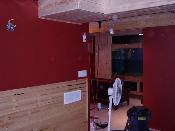 5. This is a photolooking into the room prior to the floor being finished. The aquarium is being filled with a garden hose, which I found to be the quickest method to fill it, and the built in plumbing will maintain it after that.