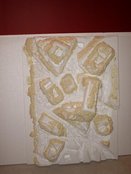 6. After making sure all the engineering was acceptable, I began designing the background. I collected styrofoam through friends, dumpster-diving and appliance stores. I starter out with a couple sheets on styro insulation and cut and sculpted shapes gluing them together with aquarium safe caulk. I would use spray foam insulation to fill in gaps and make various shapes. After sculpting with a knife, a torch was used to round and form the shapes. I built it in sections to carefully secure into the aquarium.